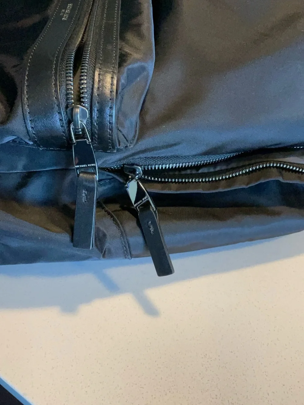 Black Michael Kors Kent Backpack. Silver hardware